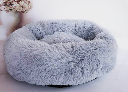 Lit rond douillet pour chiens et chats, idéal pour le repos.