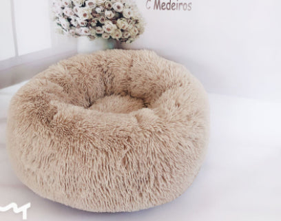 Lit rond douillet pour chiens et chats, idéal pour le repos.